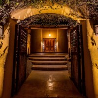 Gated arch entry corridor with FX Luminaire lighting