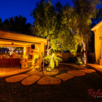 patio area lit up with landscape lighting